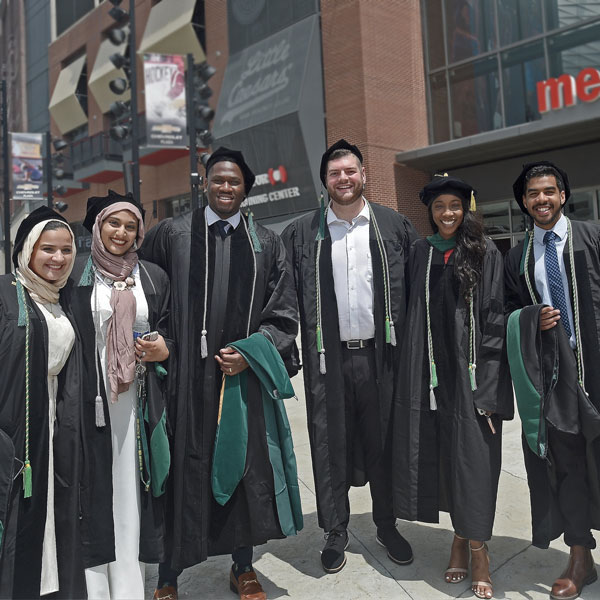Diverse group of students in graduation robes